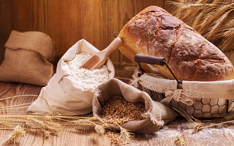 Freshly baked artisan bread loaves on a wooden table